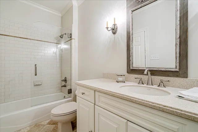 a bathroom with a sink toilet tub and shower
