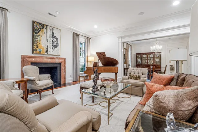 a living room with furniture two couches and a fireplace