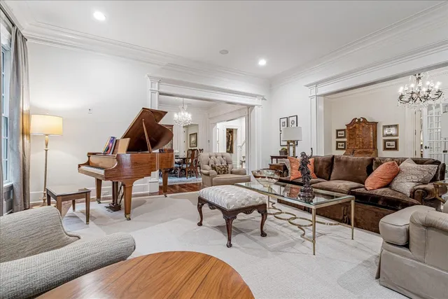 a living room with furniture and a lamp