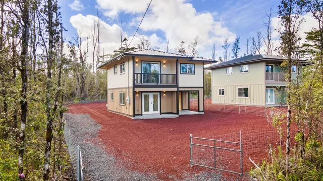 a view of a house with a yard and balcony
