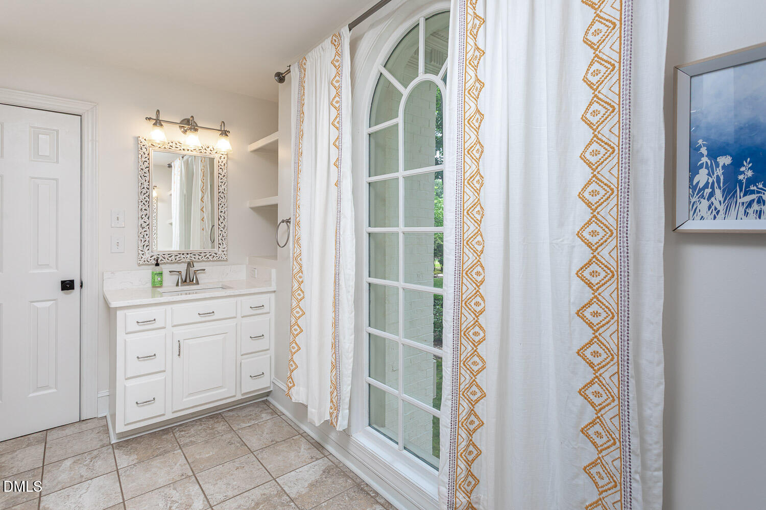 8509 Towneley Place Raleigh, NC 27615 - Photo 24 of 36 a bathroom with a sink and a mirror