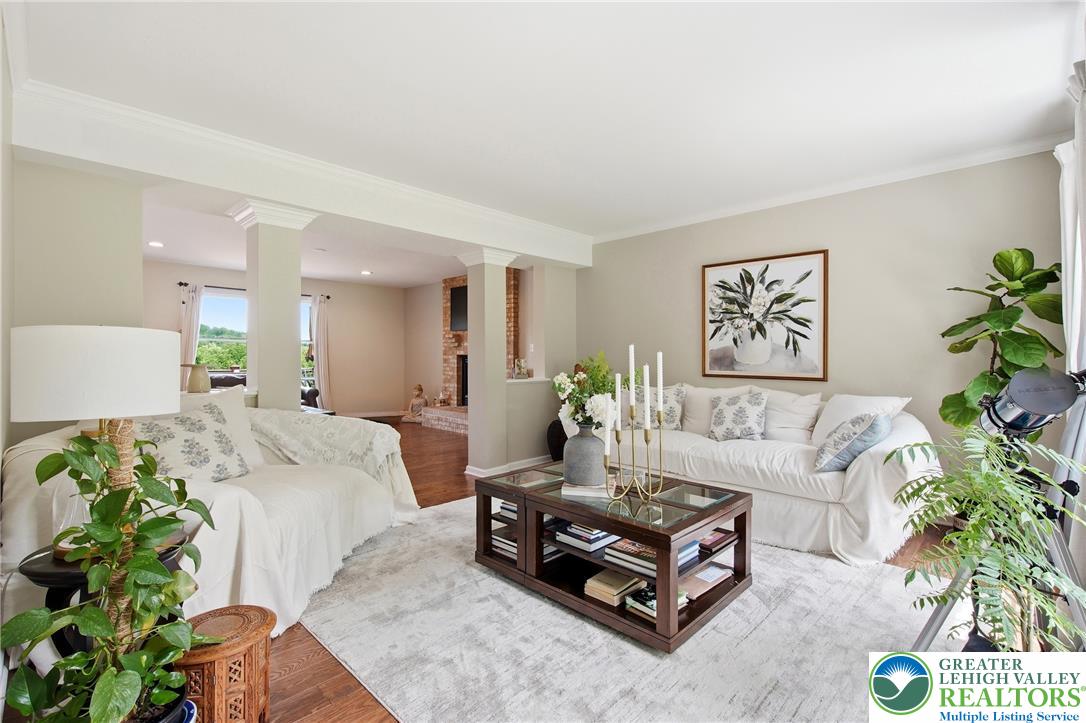 115 West Butternut Road Hellertown, PA 18055 - Photo 29 of 97 Enjoy comfortable living in this airy space, featuring rich hardwood flooring and a charming fireplace.