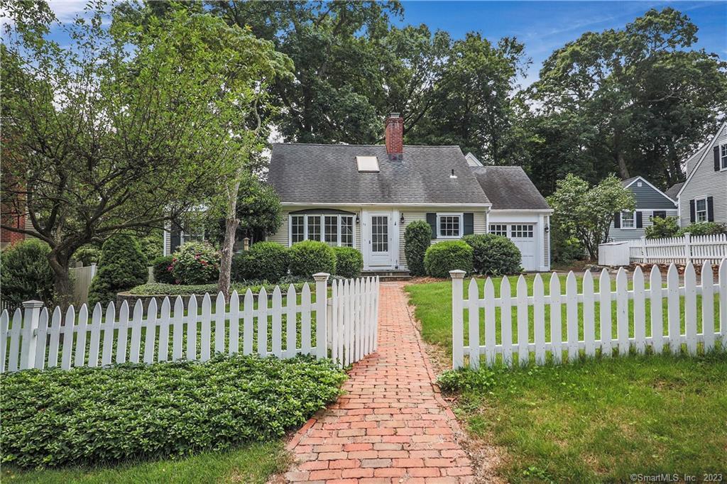 a front view of a house with a small yard