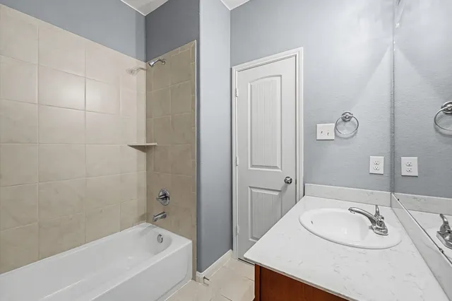 a bathroom with a sink and a bathtub