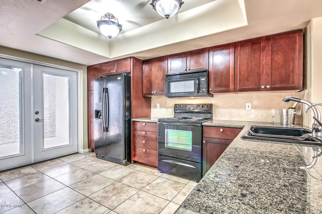 4042 East Bloomfield Road Phoenix, AZ 85032 - Photo 6 of 19 Kitchen w/Access to Front Courtyard