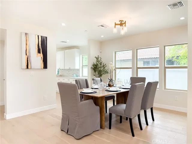 a large white kitchen with a large window