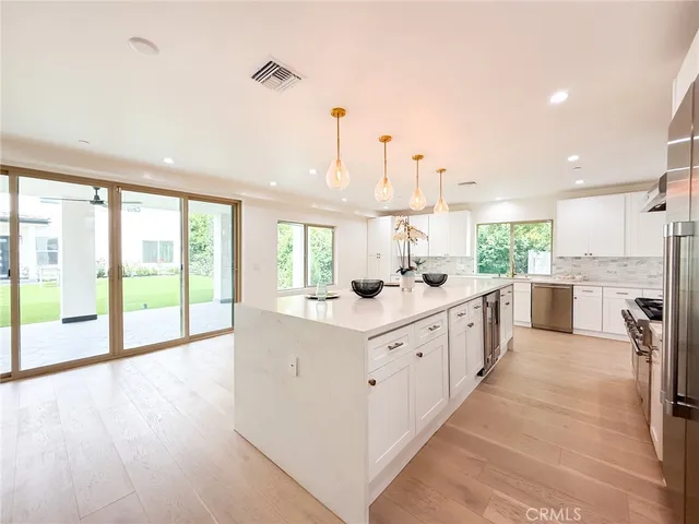 a bathroom with a toilet sink shower and a mirror