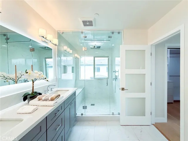 a view of house with a big yard and potted plants