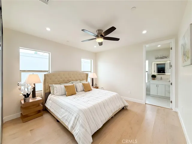 a living room with furniture kitchen view and a window