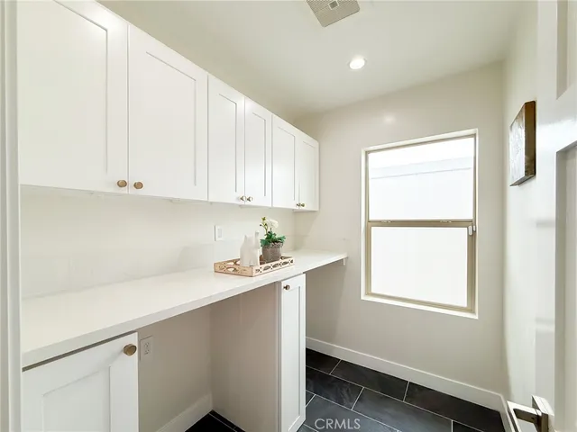 a bed room with a bed and a ceiling fan