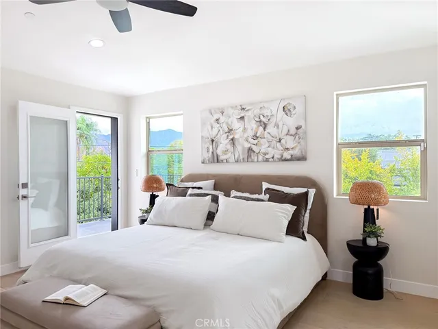 a bathroom with a toilet sink vanity and mirror