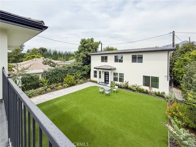 a view of a kitchen with a sink and chandelier fan