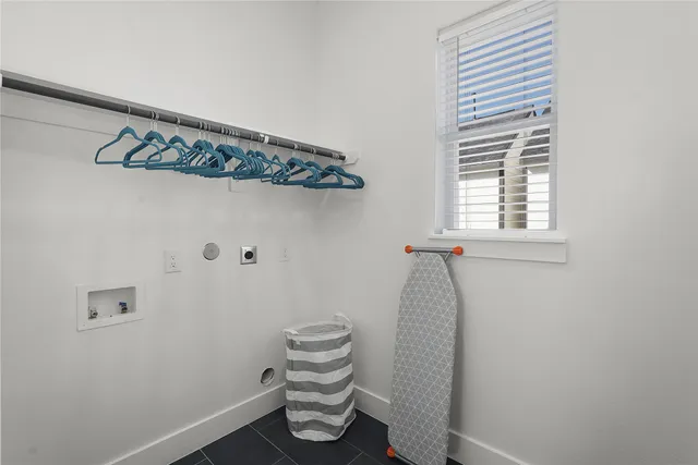 a bathroom with a window and a shower