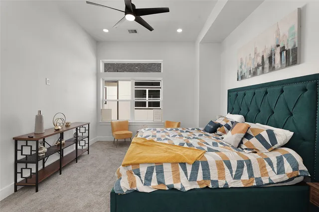 a bedroom with a bed and window