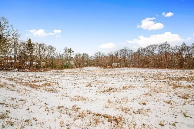 a view of yard covered with snow