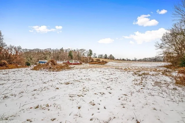 a view of yard covered with snow