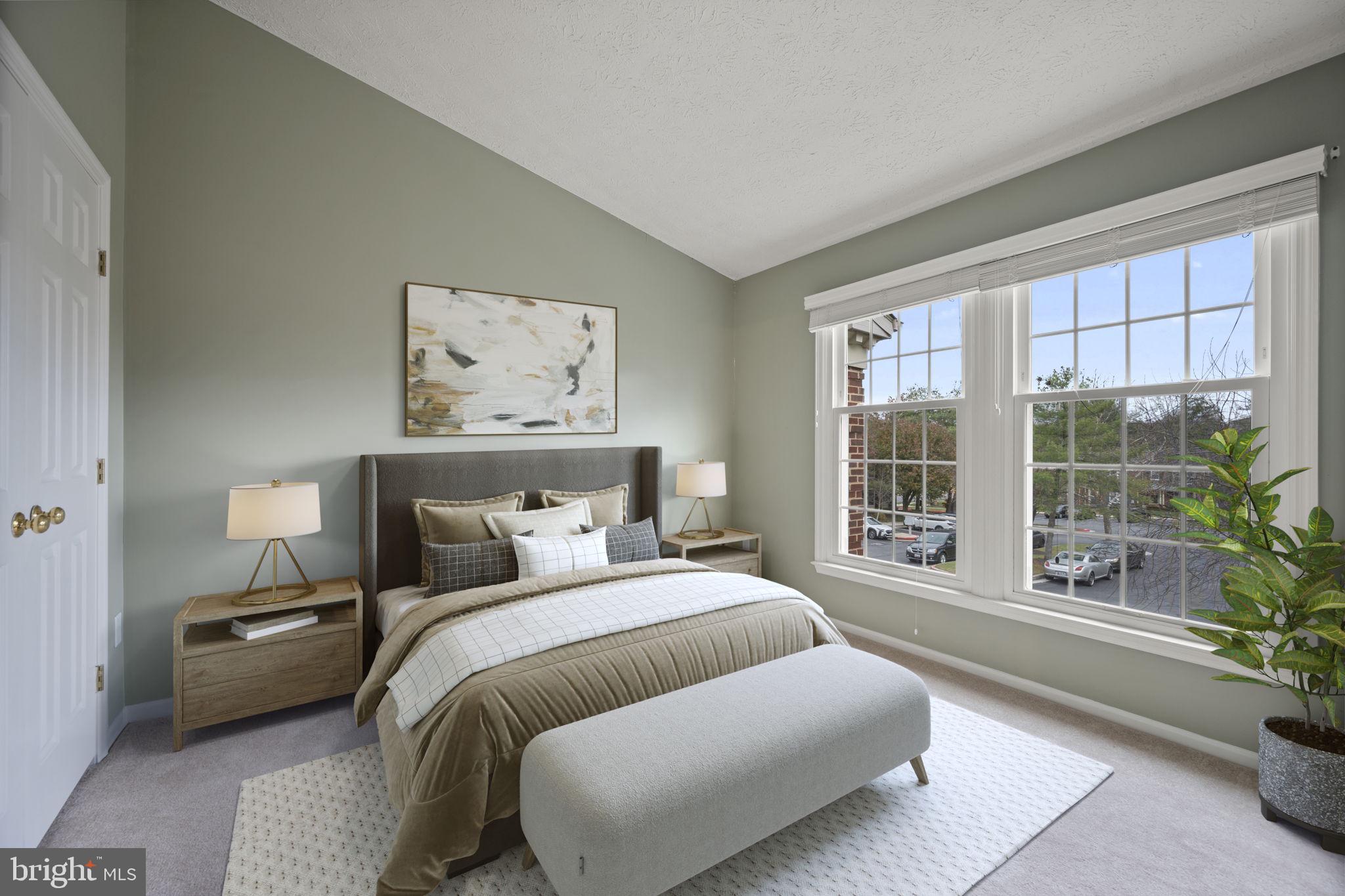 5026 Southern Star Terrace Columbia, MD 21044 - Photo 21 of 47 a bedroom with a large bed and a large window