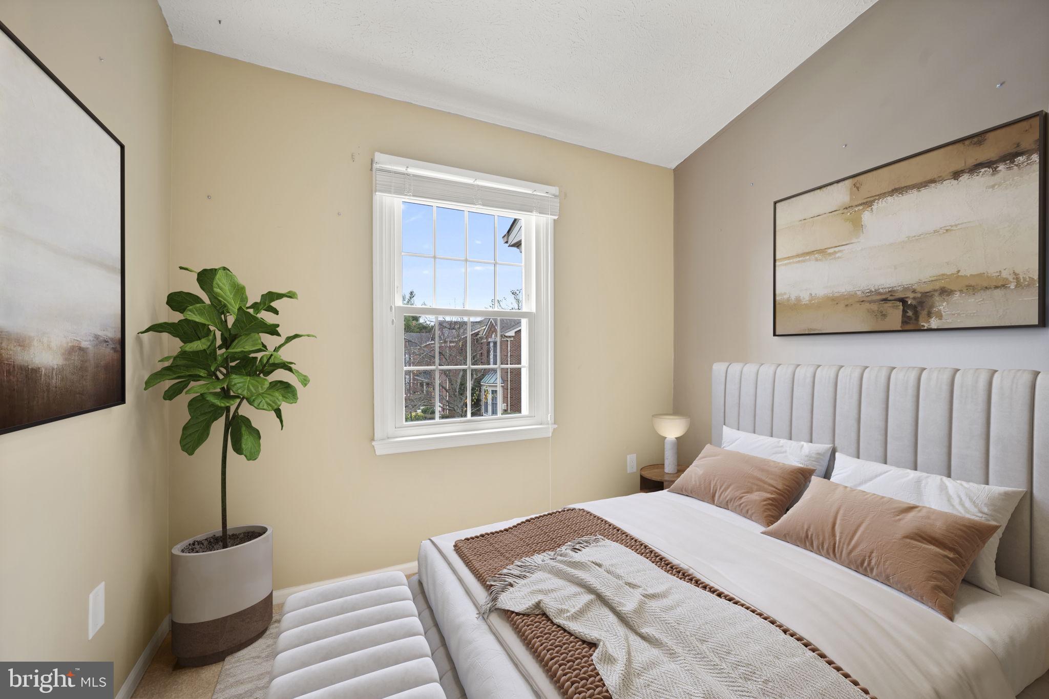 5026 Southern Star Terrace Columbia, MD 21044 - Photo 24 of 47 a bedroom with a large bed and a potted plant