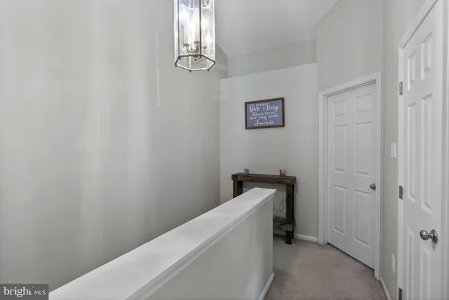 a view of a hallway with workspace