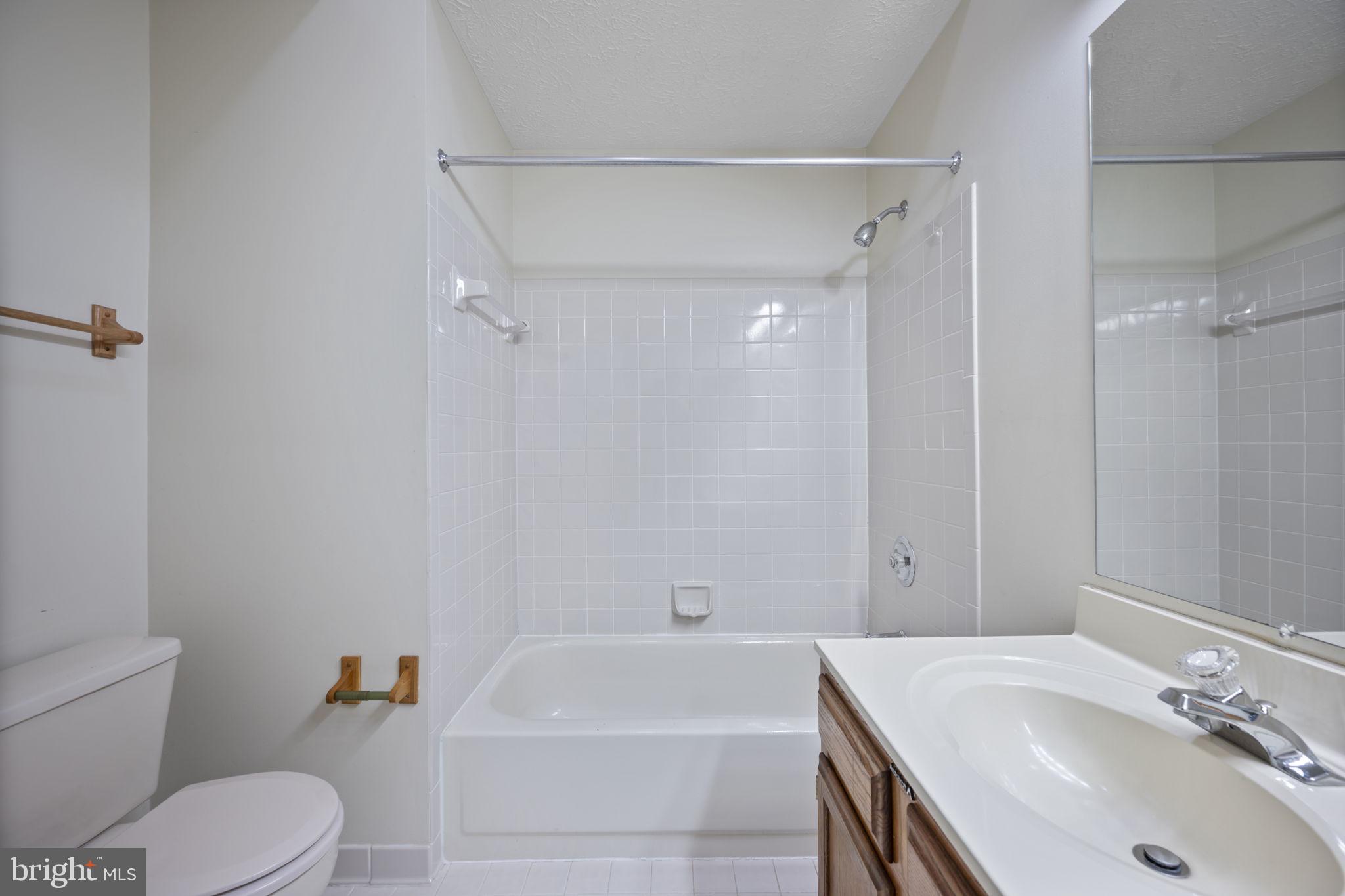 5026 Southern Star Terrace Columbia, MD 21044 - Photo 28 of 47 a bathroom with a sink a toilet and shower