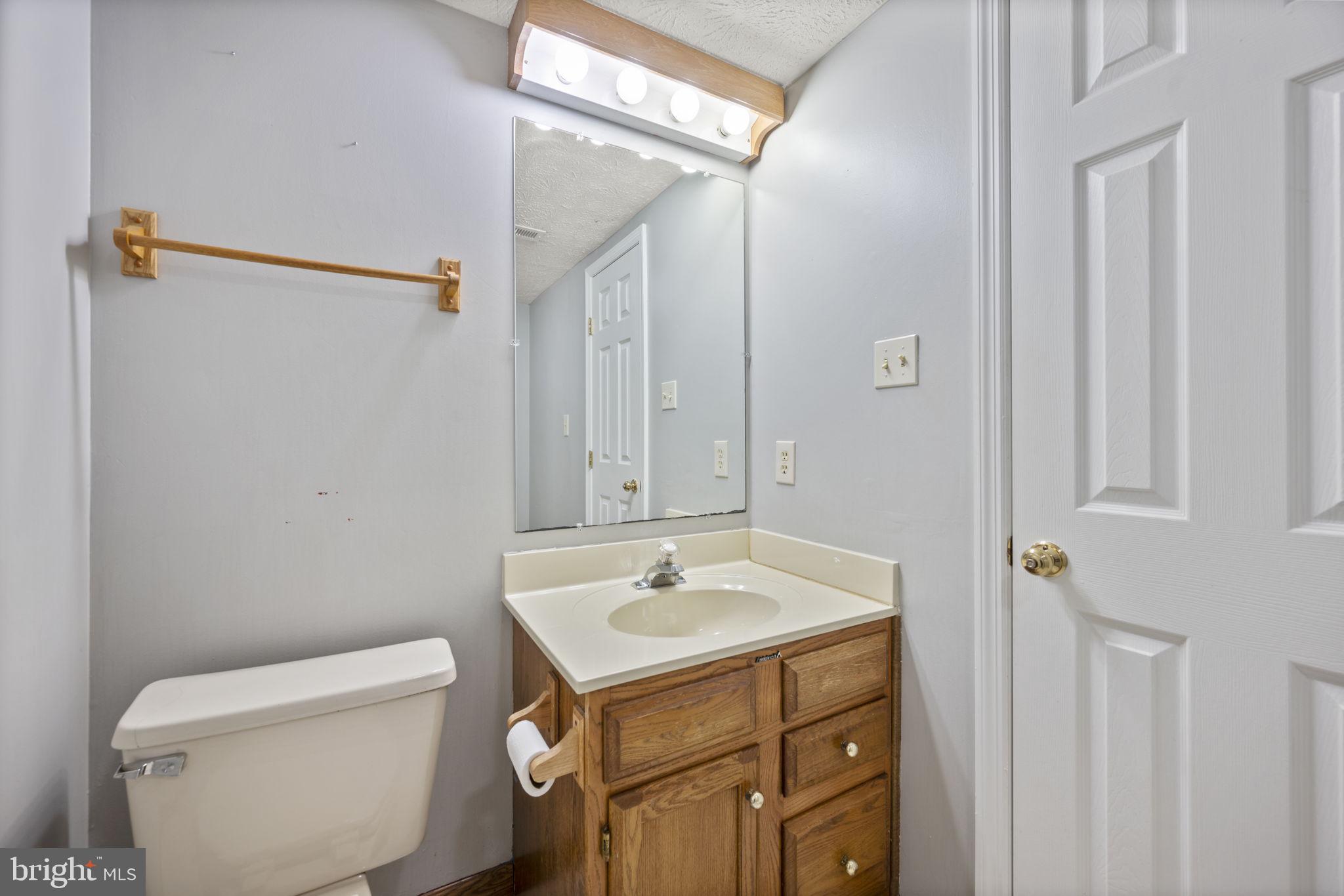 5026 Southern Star Terrace Columbia, MD 21044 - Photo 34 of 47 a bathroom with a sink toilet and shower