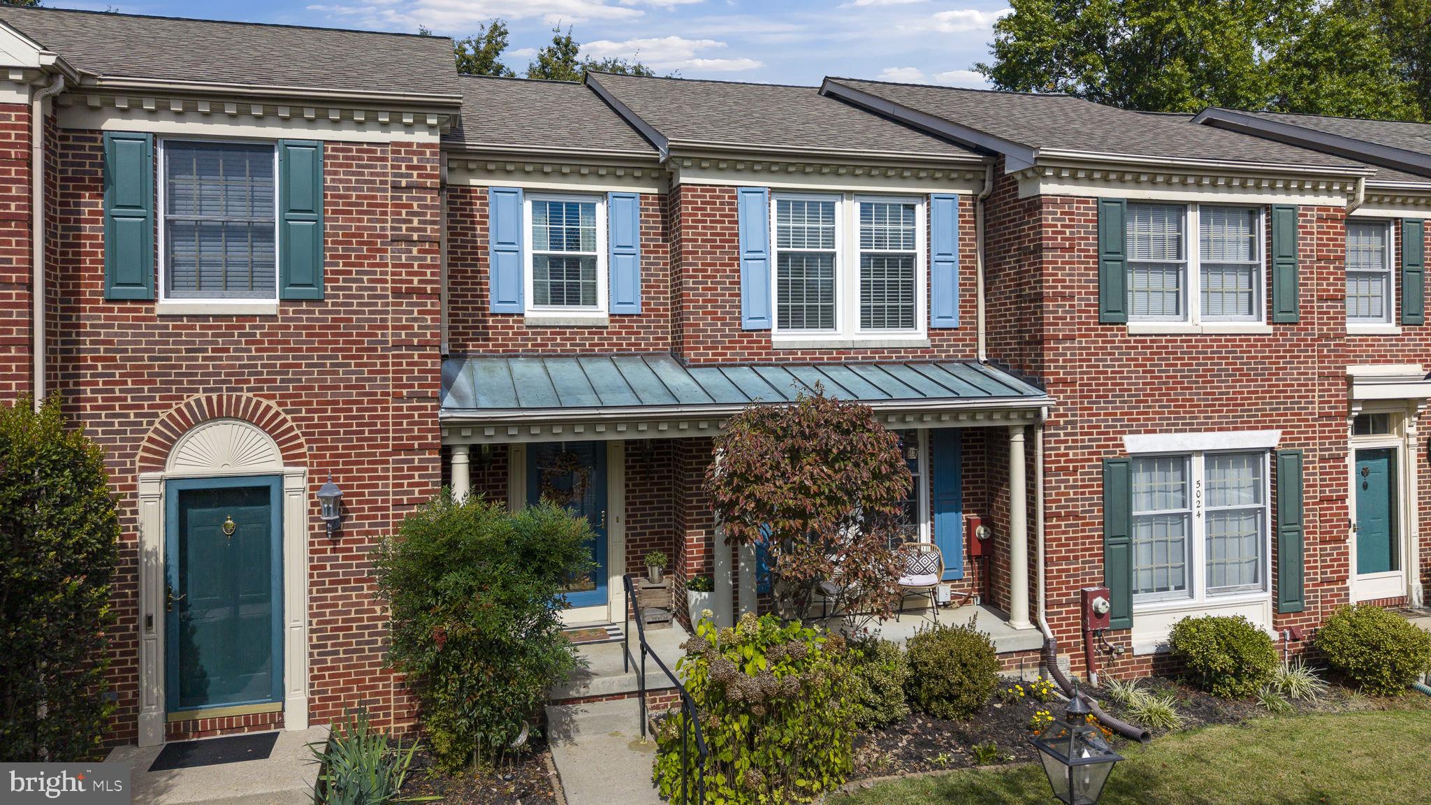 5026 Southern Star Terrace Columbia, MD 21044 - Photo 41 of 47 a front view of a house with plants and entryway