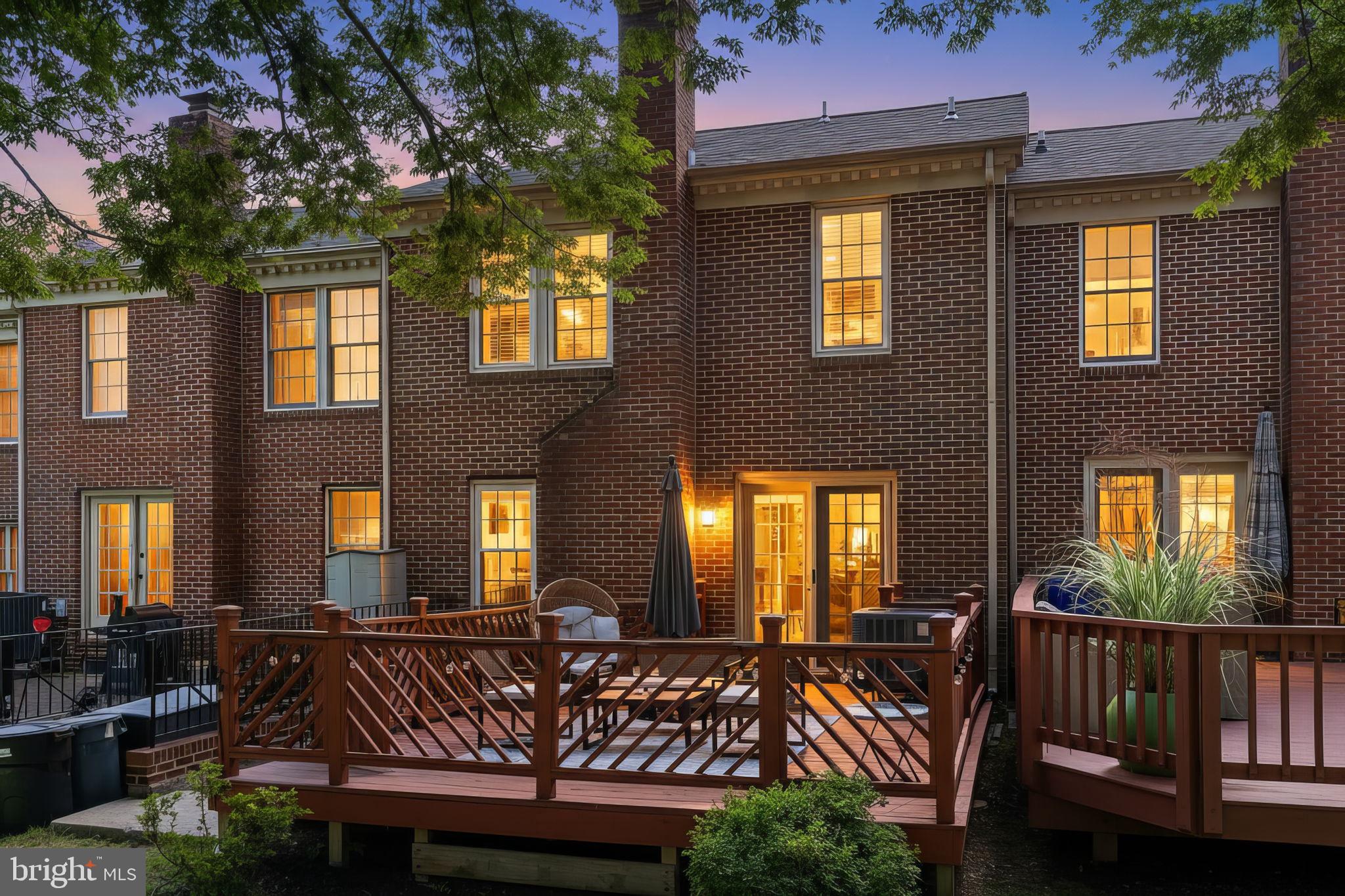 5026 Southern Star Terrace Columbia, MD 21044 - Photo 43 of 47 a view of a brick house with large windows and furniture