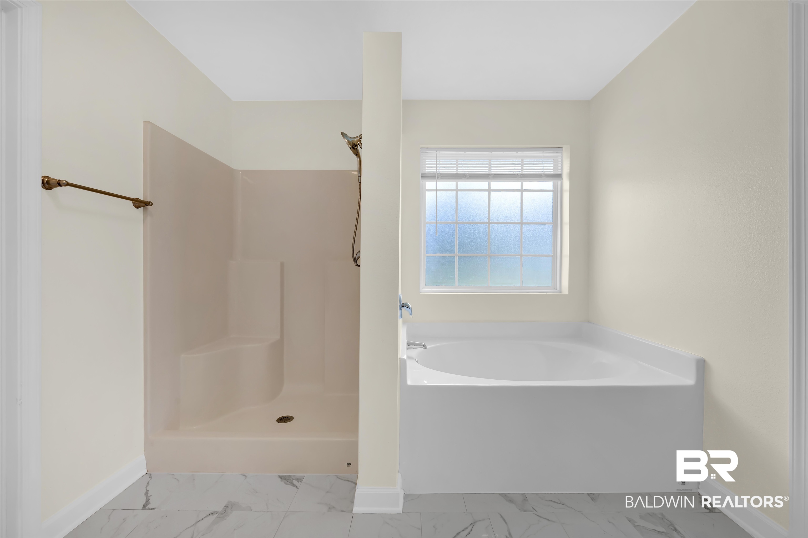 10147 Lyttleton Loop Lillian, AL 36549 - Photo 21 of 29 Bathroom featuring a built-in soaking tub, separate shower with integrated seating, and large-format tile flooring
