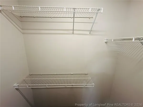 a view of a room with racks on the wall
