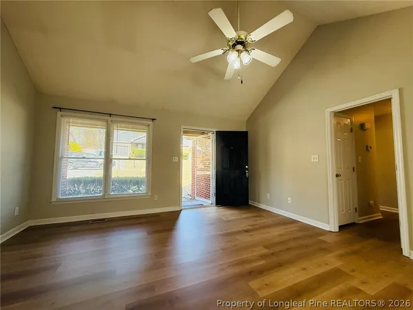 wooden floor in an empty room with a window