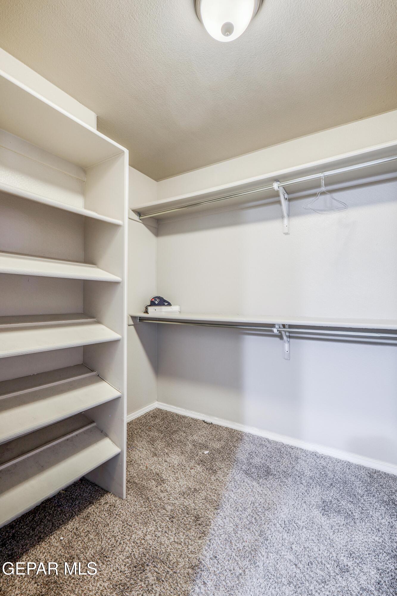 964 Penrith Street El Paso, TX 79928 - Photo 49 of 62 a view of walk in closet with empty racks
