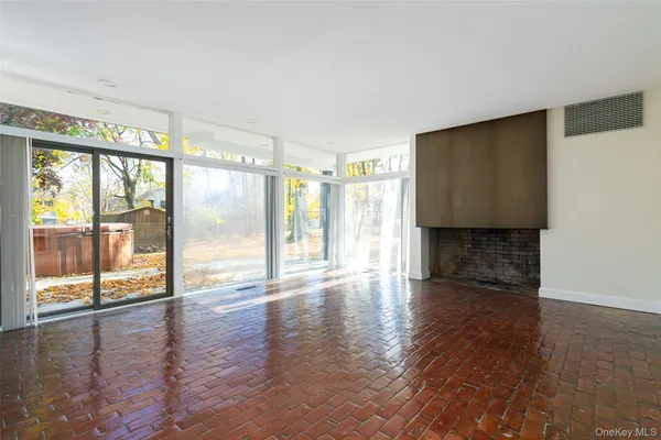 a view of a livingroom with furniture and an entryway