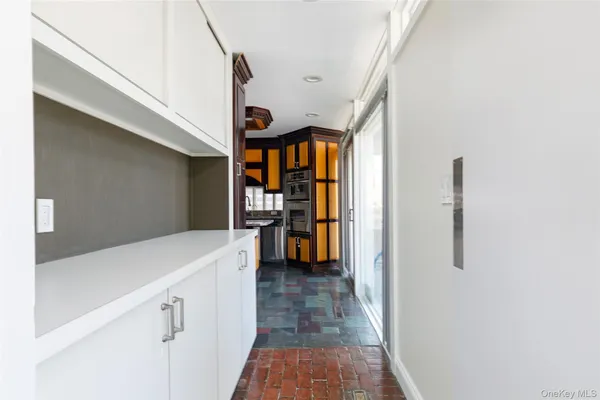 a hallway with cabinets