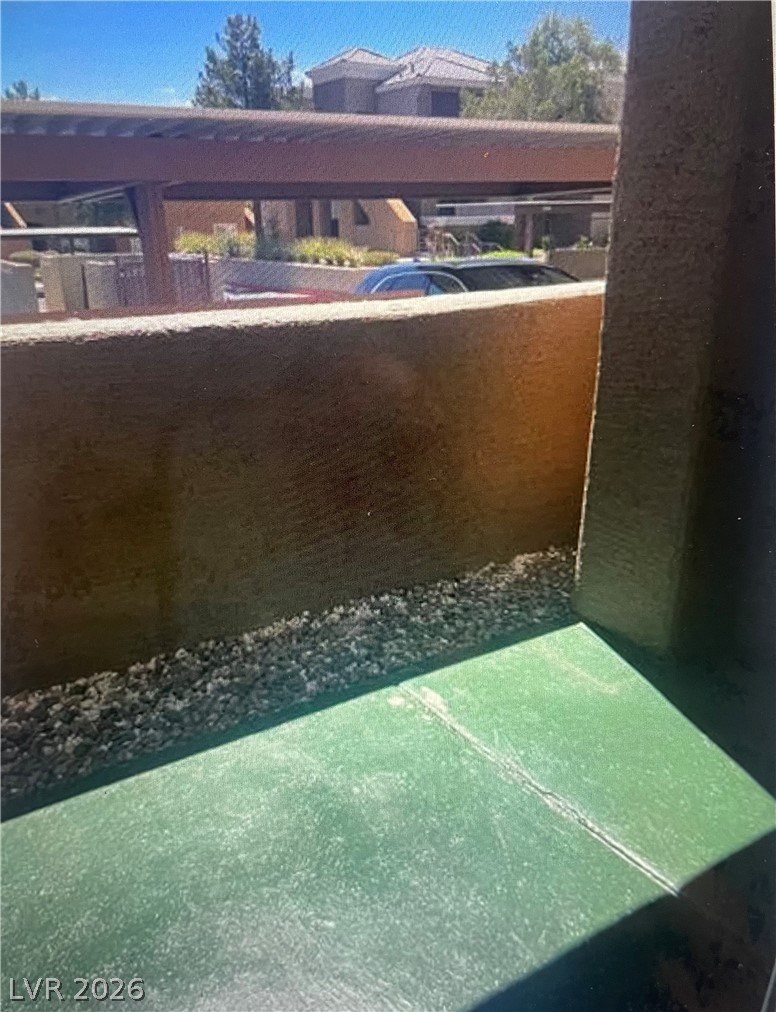 8070 West Russell Road, Unit 1092 Las Vegas, NV 89113 - Photo 14 of 14 A private covered patio overlooks the surrounding community and parking structures.