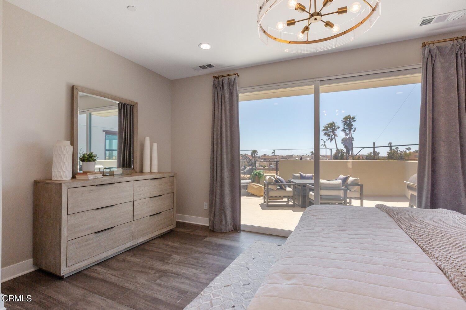 1030 Harbor Boulevard Oxnard, CA 93035 - Photo 13 of 24 a room with a bed and large window