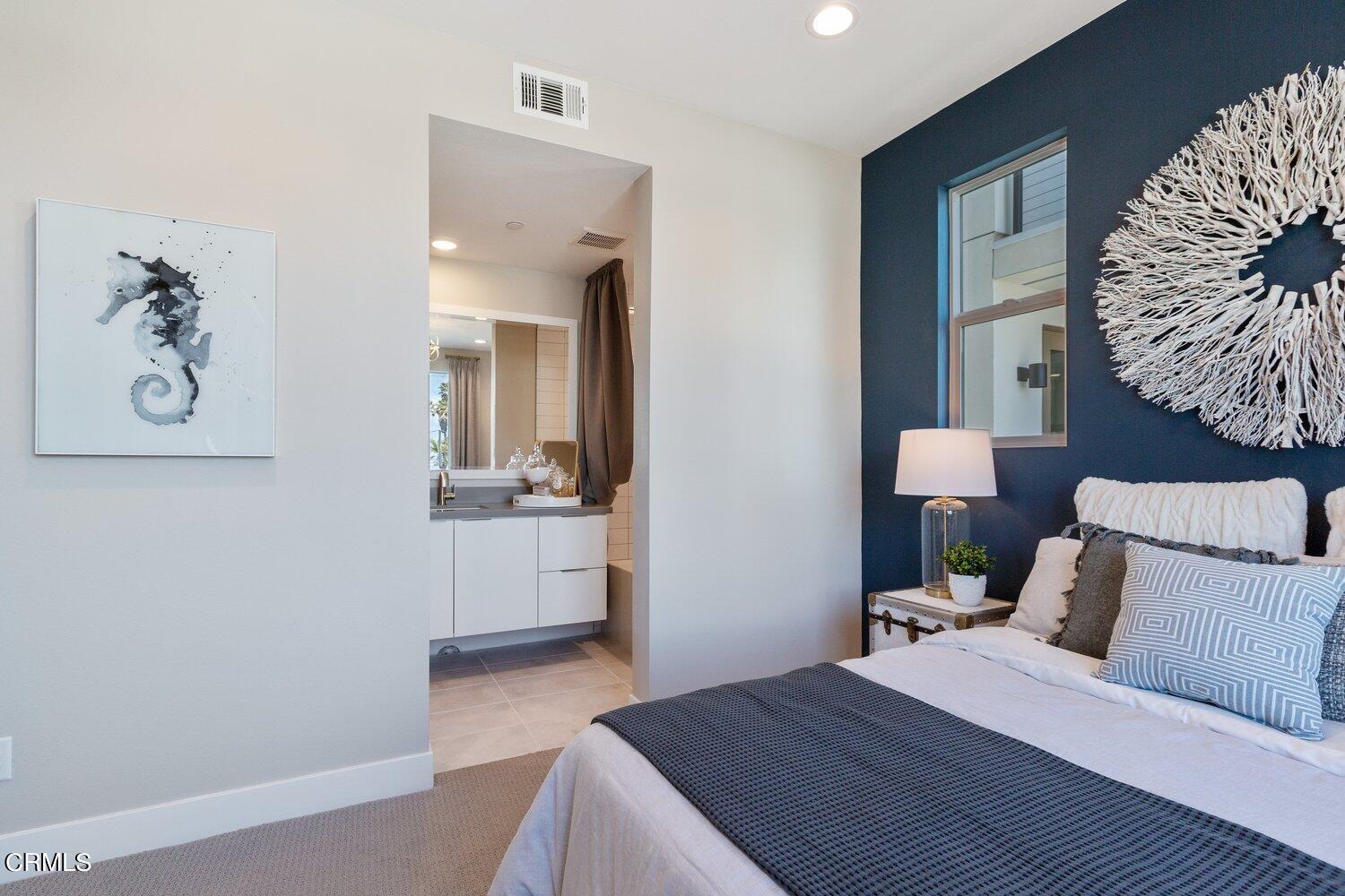 1030 Harbor Boulevard Oxnard, CA 93035 - Photo 17 of 24 a bedroom with a bed and a couch