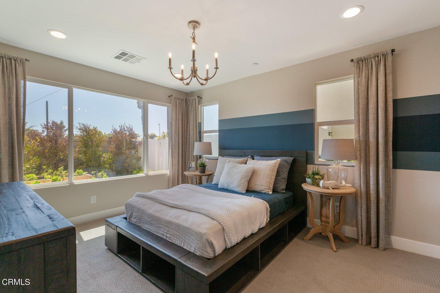 1030 Harbor Boulevard Oxnard, CA 93035 - Photo 23 of 24 a bedroom with a bed and a large window