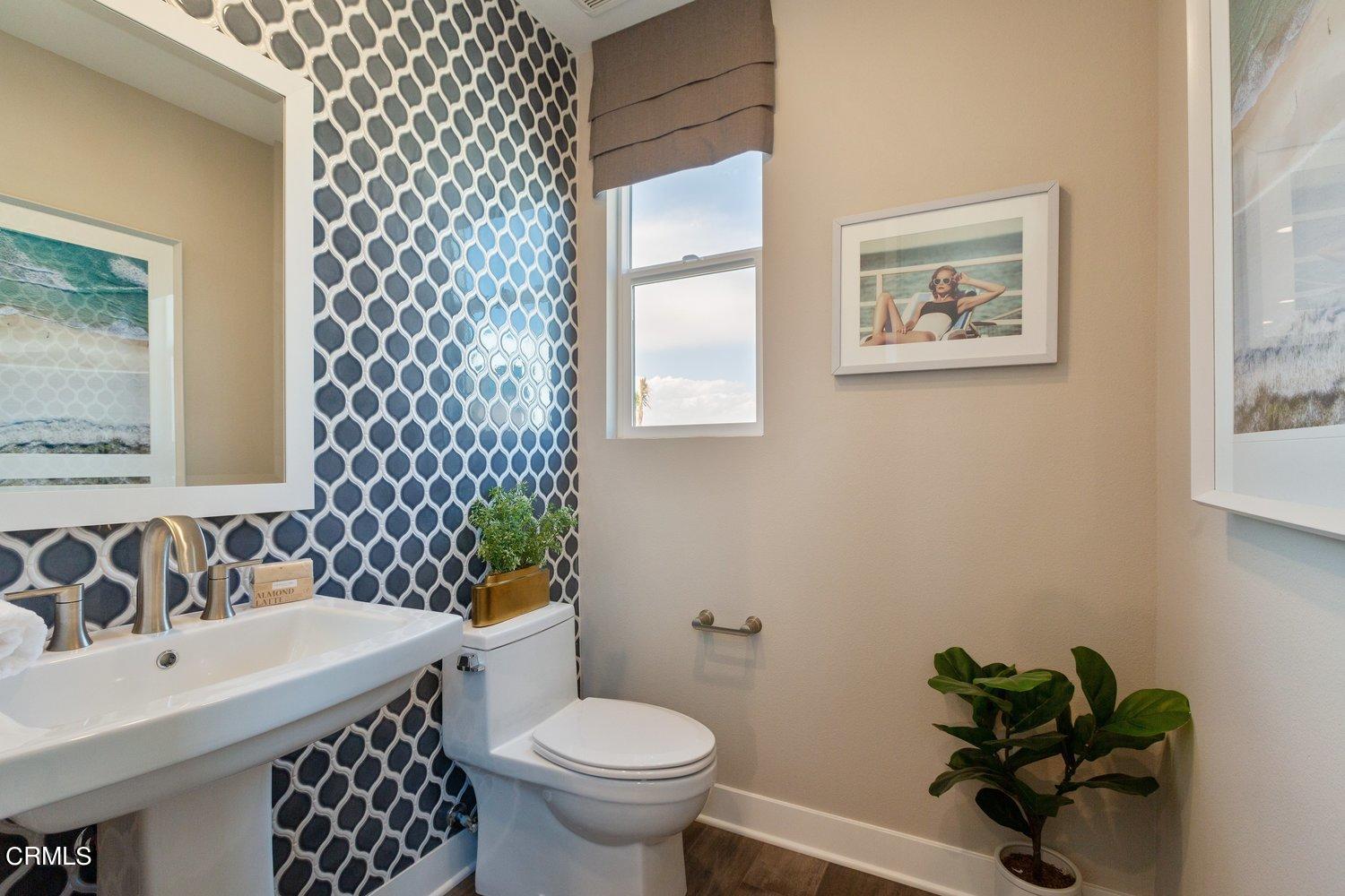 1030 Harbor Boulevard Oxnard, CA 93035 - Photo 24 of 24 a bathroom with a sink toilet and mirror