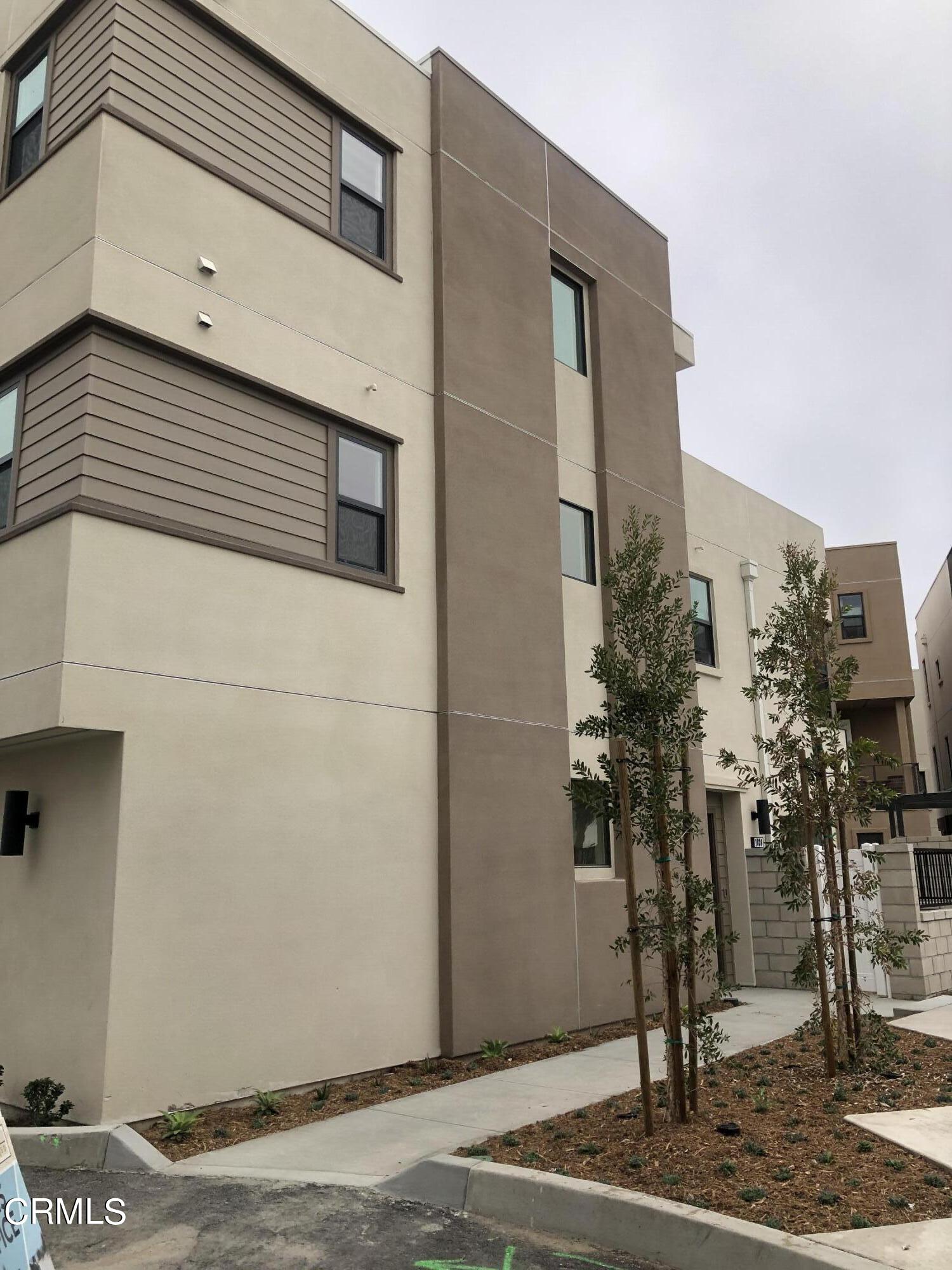 1030 Harbor Boulevard Oxnard, CA 93035 - Photo 5 of 24 a view of path along with building