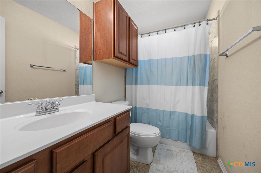 910 Neuberry Cliffe Temple, TX 76502 - Photo 20 of 32 a bathroom with a sink a toilet and shower