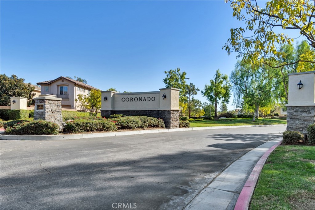 4543 Riverscape Drive Riverside, CA 92505 - Photo 1 of 25 a front view of a house with a yard and garage