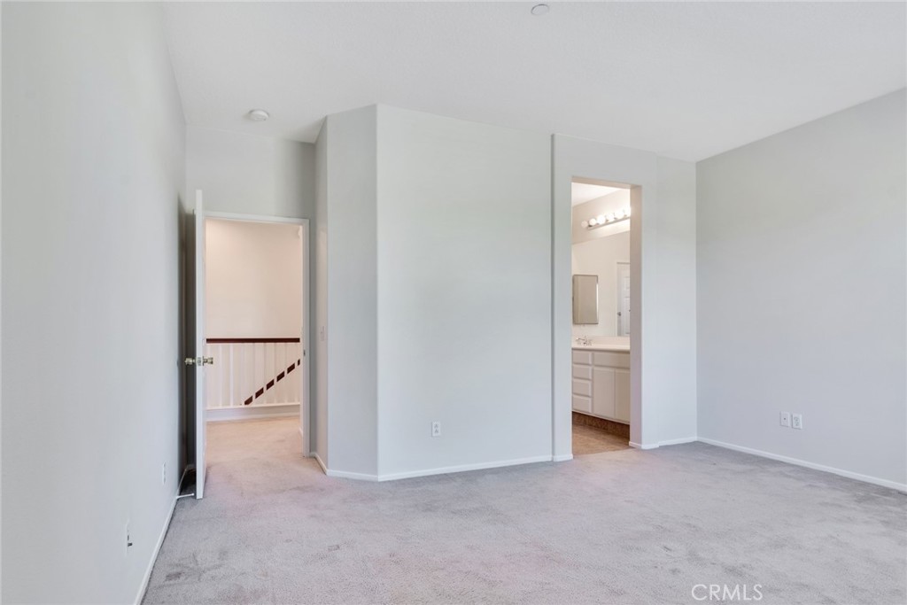 4543 Riverscape Drive Riverside, CA 92505 - Photo 14 of 25 a view of a room with a hallway and closet