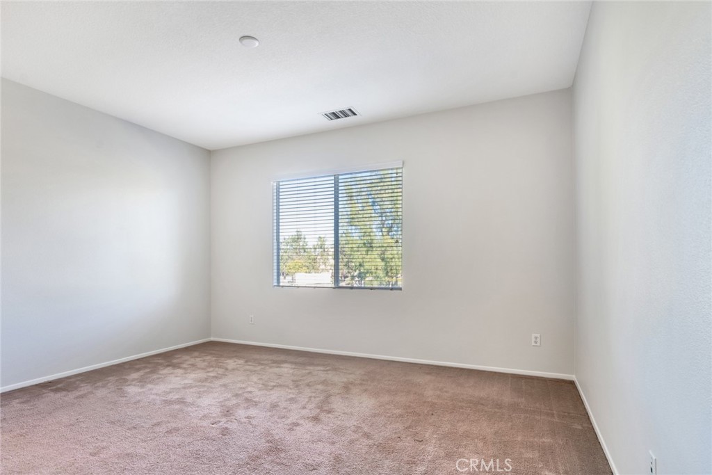 4543 Riverscape Drive Riverside, CA 92505 - Photo 15 of 25 an empty room with windows