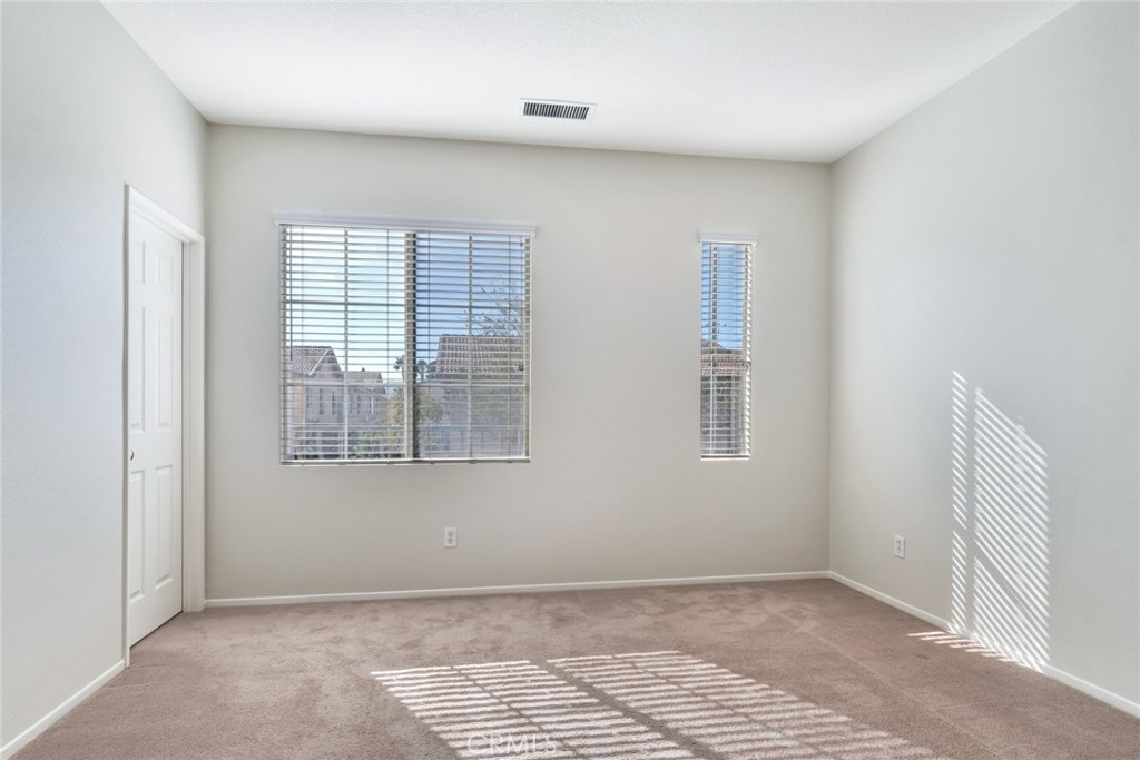 4543 Riverscape Drive Riverside, CA 92505 - Photo 17 of 25 a view of an empty room with a window