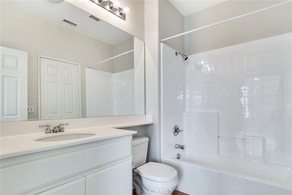 4543 Riverscape Drive Riverside, CA 92505 - Photo 18 of 25 a bathroom with a sink a toilet and shower
