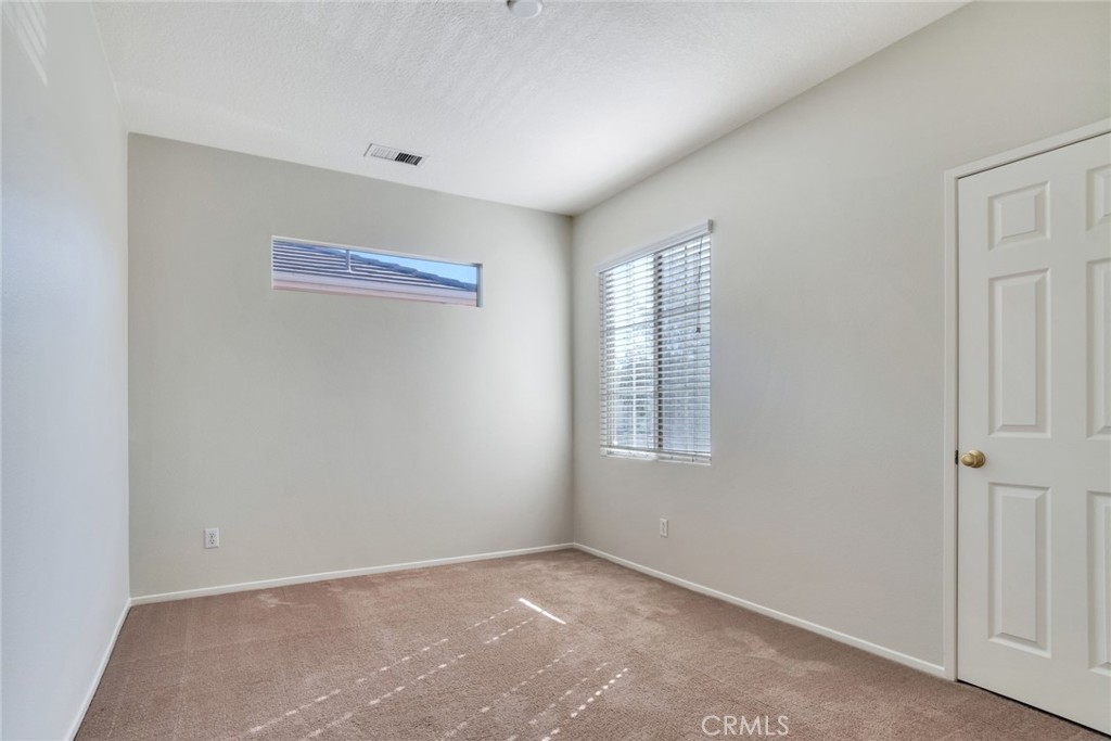 4543 Riverscape Drive Riverside, CA 92505 - Photo 19 of 25 an empty room with windows