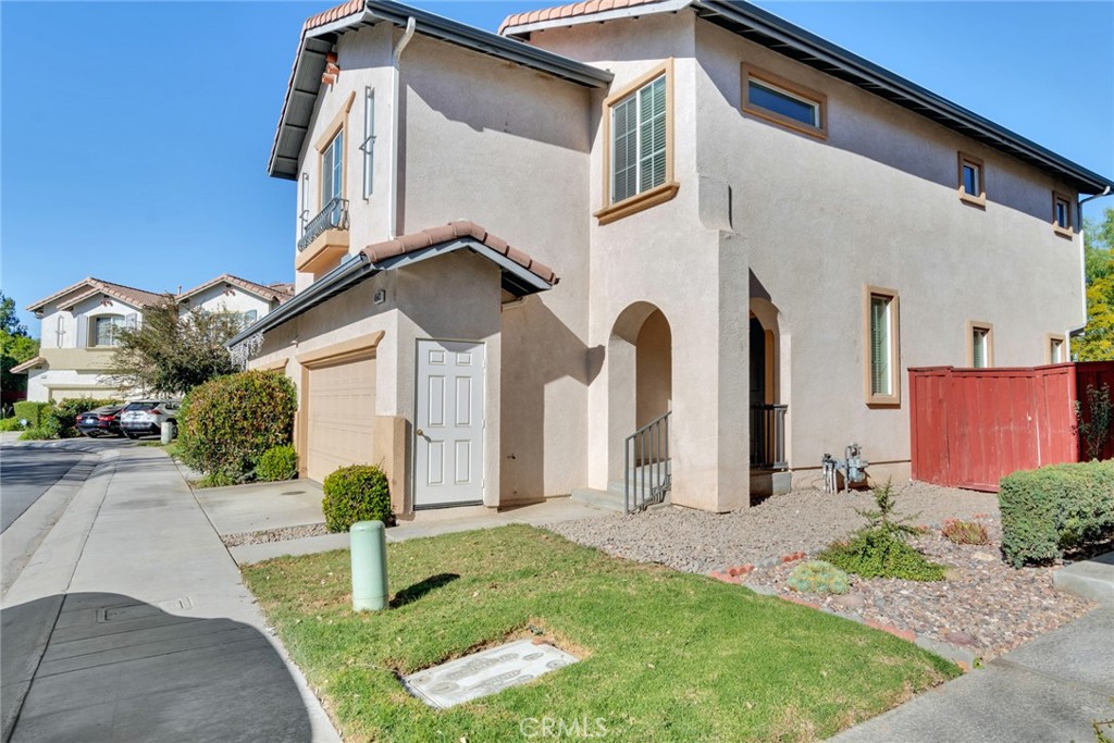 4543 Riverscape Drive Riverside, CA 92505 - Photo 3 of 25 a front view of a house with garden