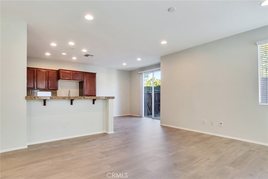 4543 Riverscape Drive Riverside, CA 92505 - Photo 7 of 25 a view of a kitchen with a sink and a refrigerator