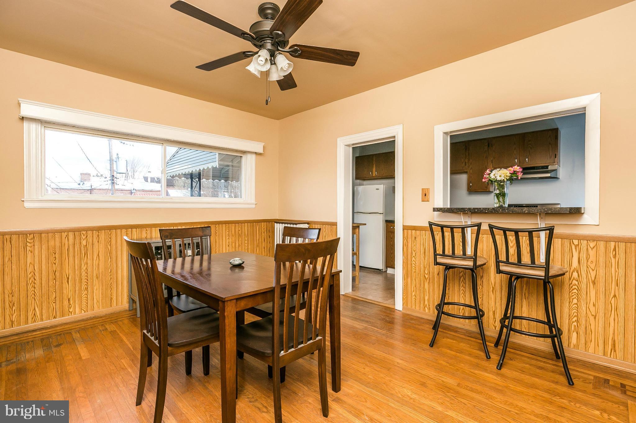 3609 Yolando Road Baltimore, MD 21218 - Photo 11 of 27 a view of a dining room with furniture window and wooden floor