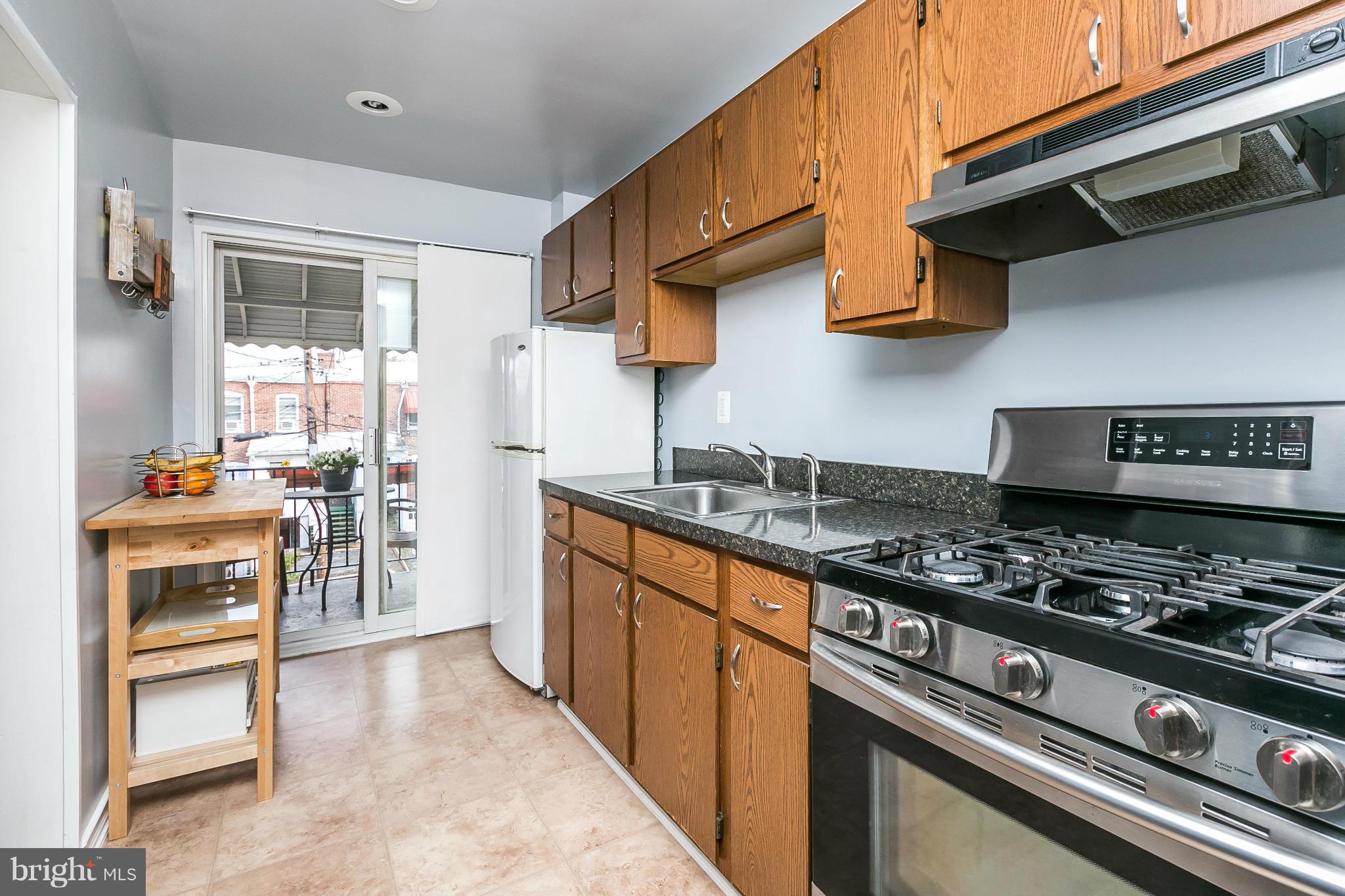 3609 Yolando Road Baltimore, MD 21218 - Photo 13 of 27 a kitchen with stainless steel appliances granite countertop a stove and a sink